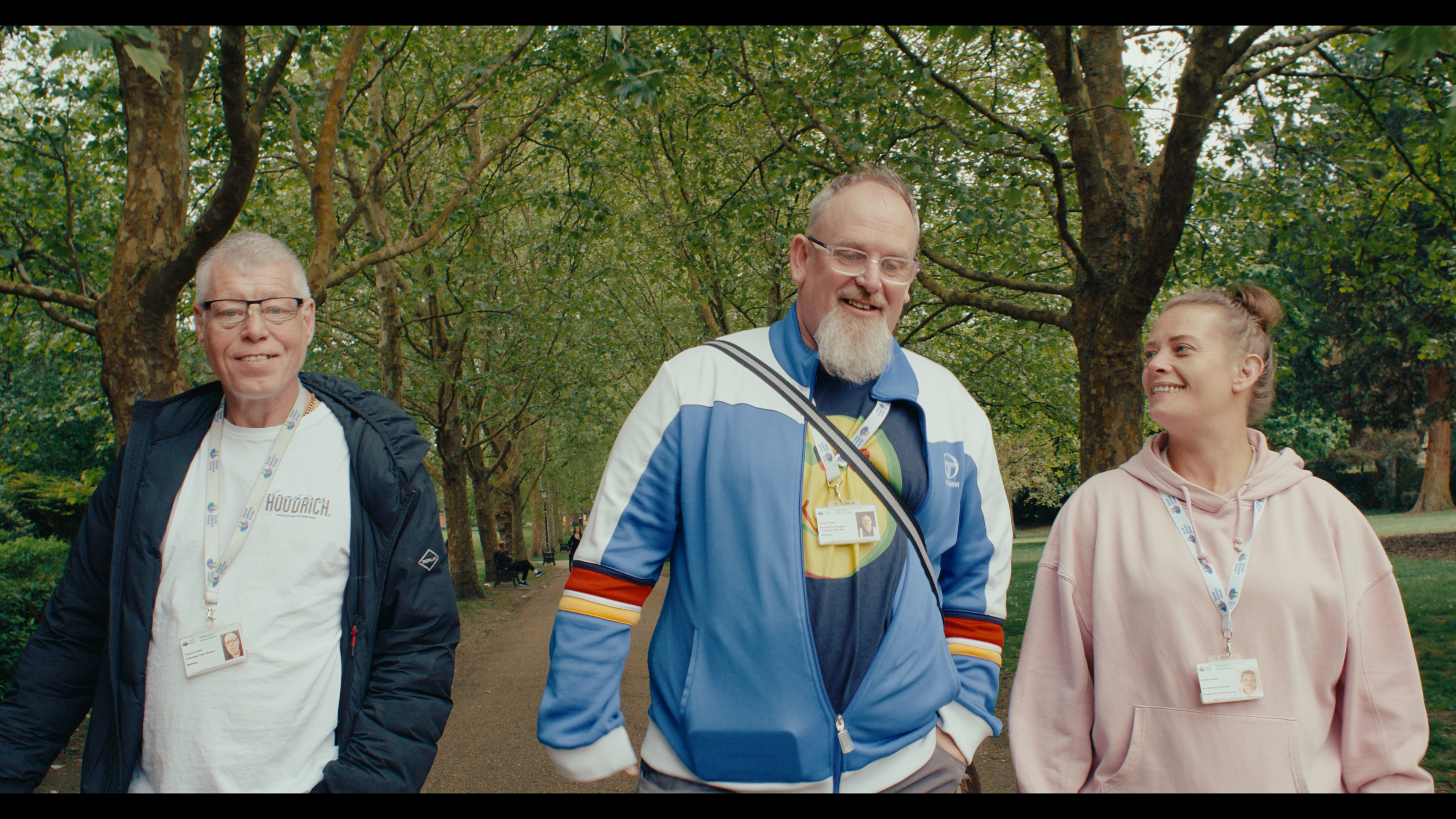Volunteers and participants walking together outdoors